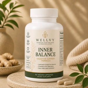Supplement bottle labeled 'Wellyy Inner Balance' on a wooden surface with plants in the background