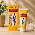 Lurlaxy warm formula product packaging on a wooden surface with a plant and towel in the background