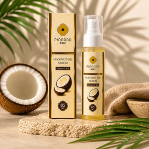 Pinnara coconut oil serum packaging with a coconut and towel on a wooden surface.
