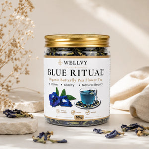 Jar of Welly Blue Ritual Organic Butterfly Pea Flower Tea with decorative elements on a neutral background