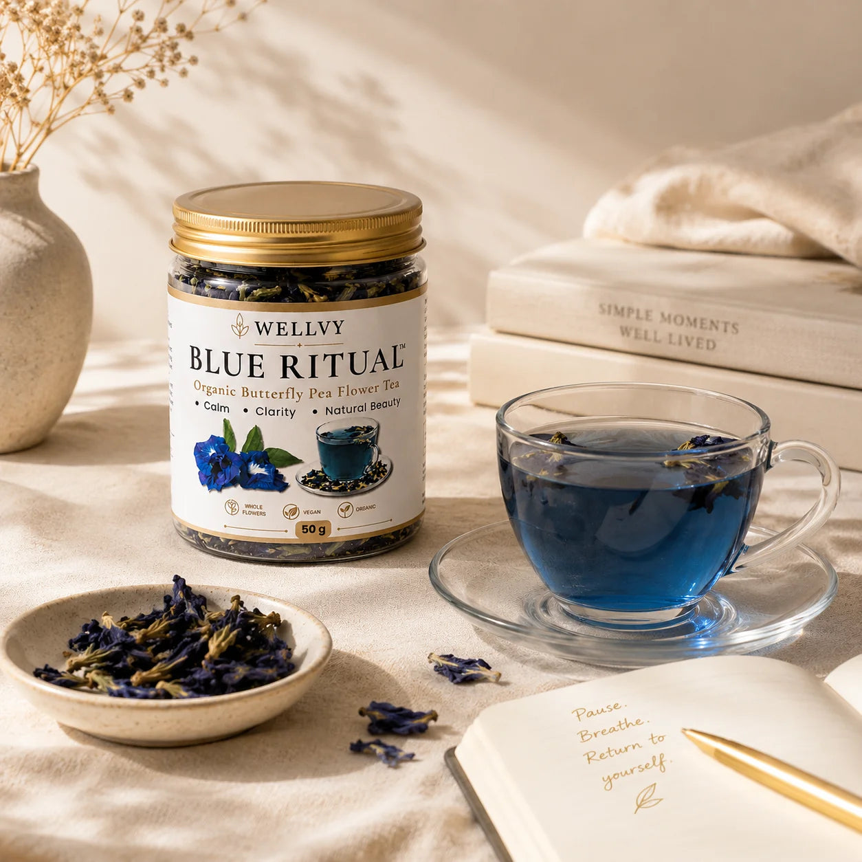 Wellvy Blue Ritual tea jar with a cup of blue tea on a table.