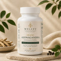 Wellvy Organic Ashwagandha supplement bottle on a neutral background with leaves.