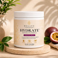 Welly Hydrate electrolyte formula container with passion fruit on a wooden surface