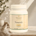 Wellvy Nourish chocolate supplement container on a neutral background