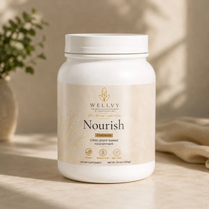 White container labeled 'Nourish' by WELLVY on a wooden surface with a blurred natural background
